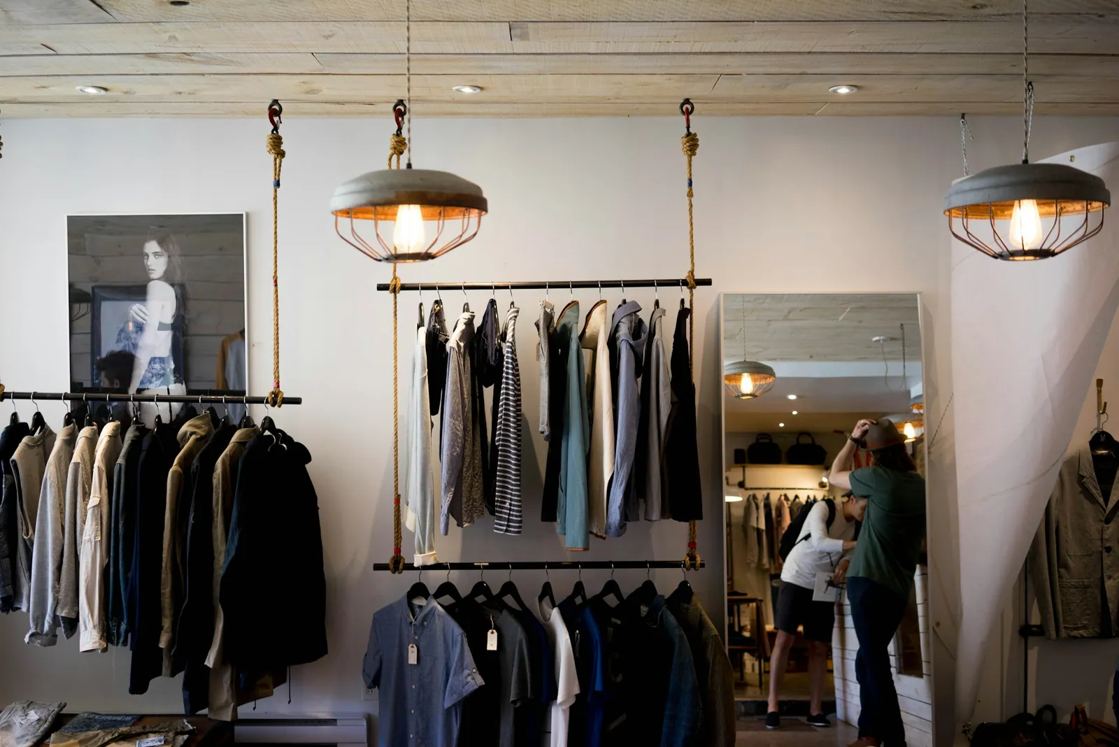 Inside a garment studio, racks of finished pieces